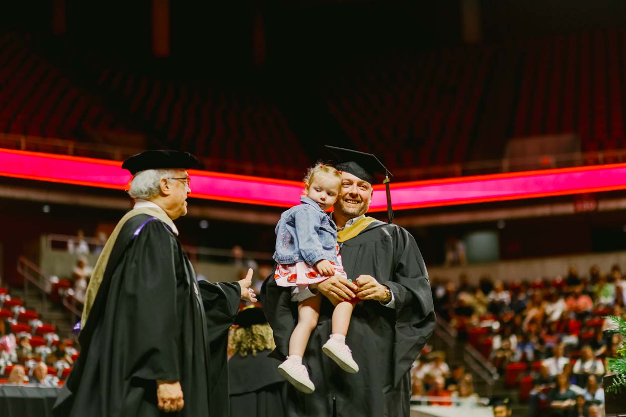 Graduate with child