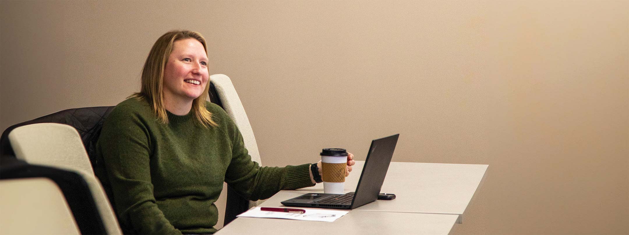 Woman sitting at laptop