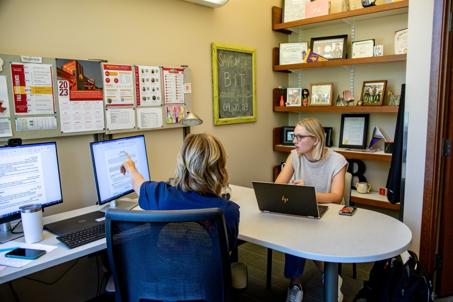 An Ivy career coordinator reviews a student's resume in advance of the career fair.