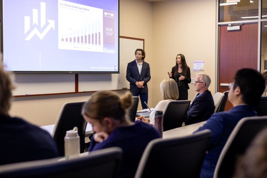 Students present their business solution to industry judges.