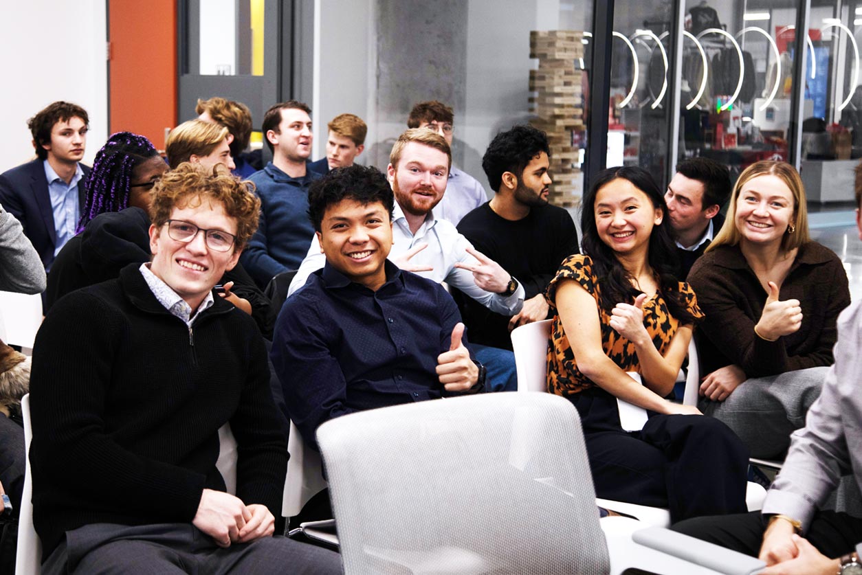 Group of student participants enjoying an event break together.