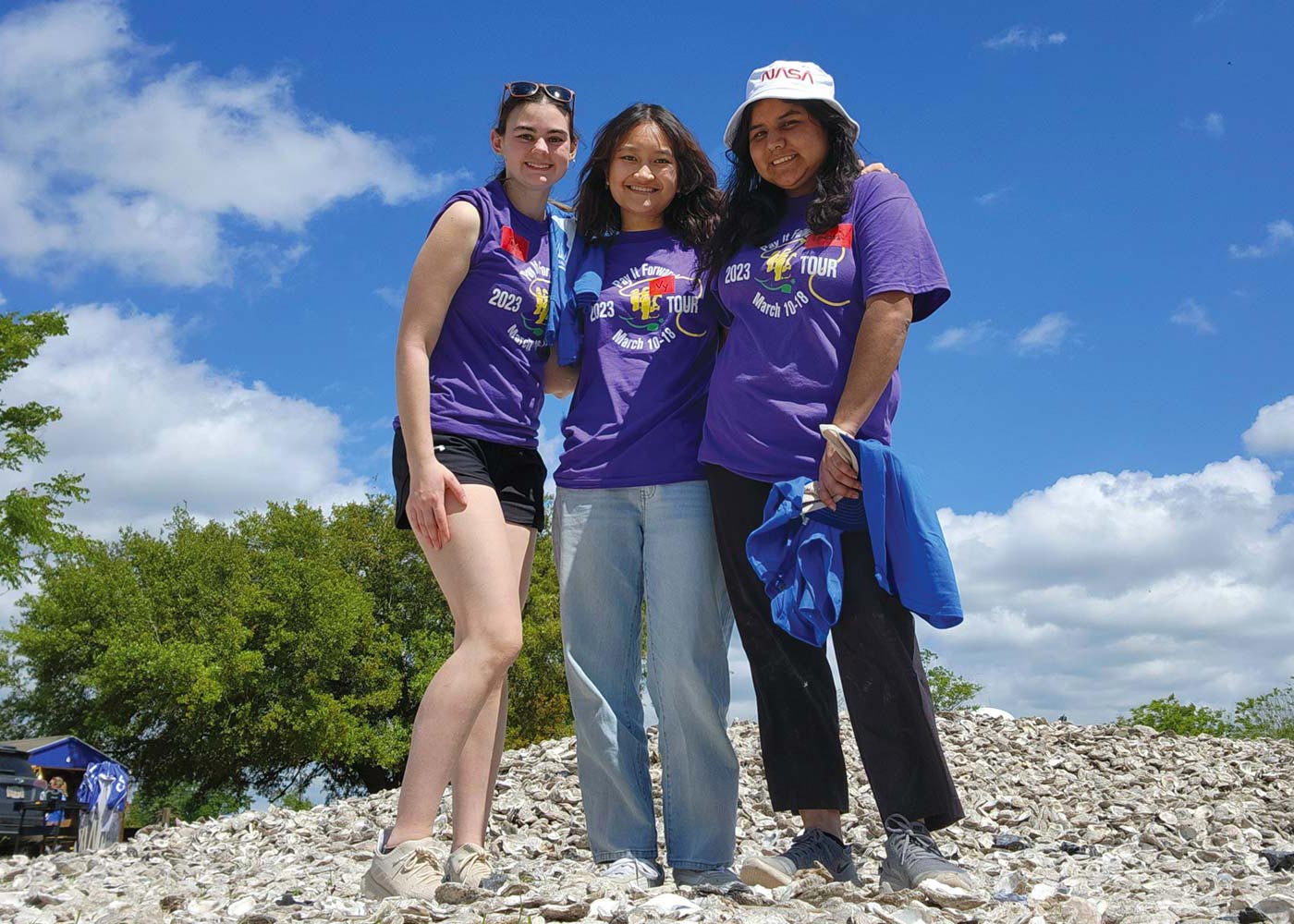 Ivy srudent, Vy Huynh pictured with her friends outside on a sunny day.